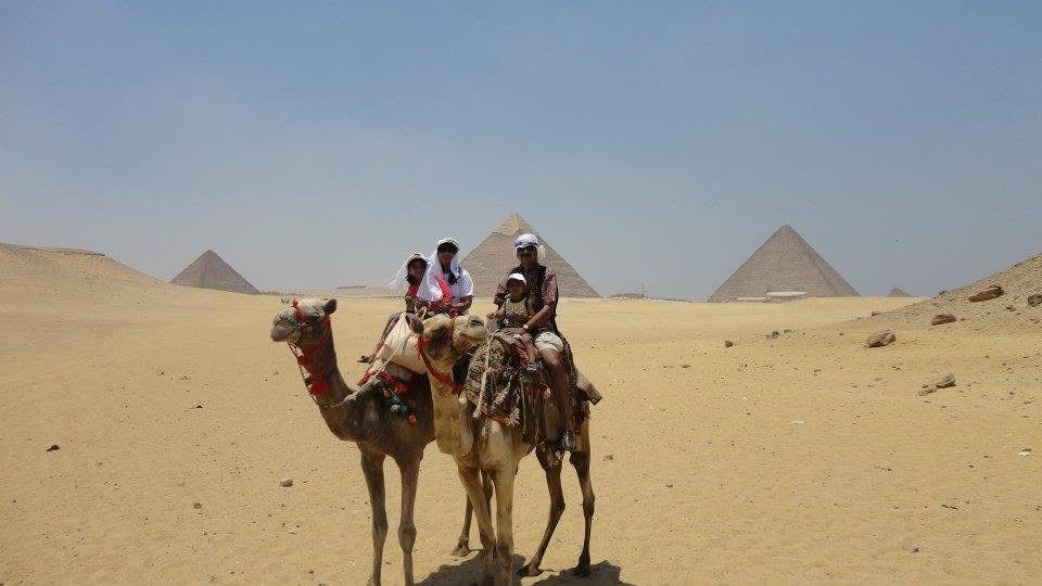 Riding camels near the pyramids of Giza