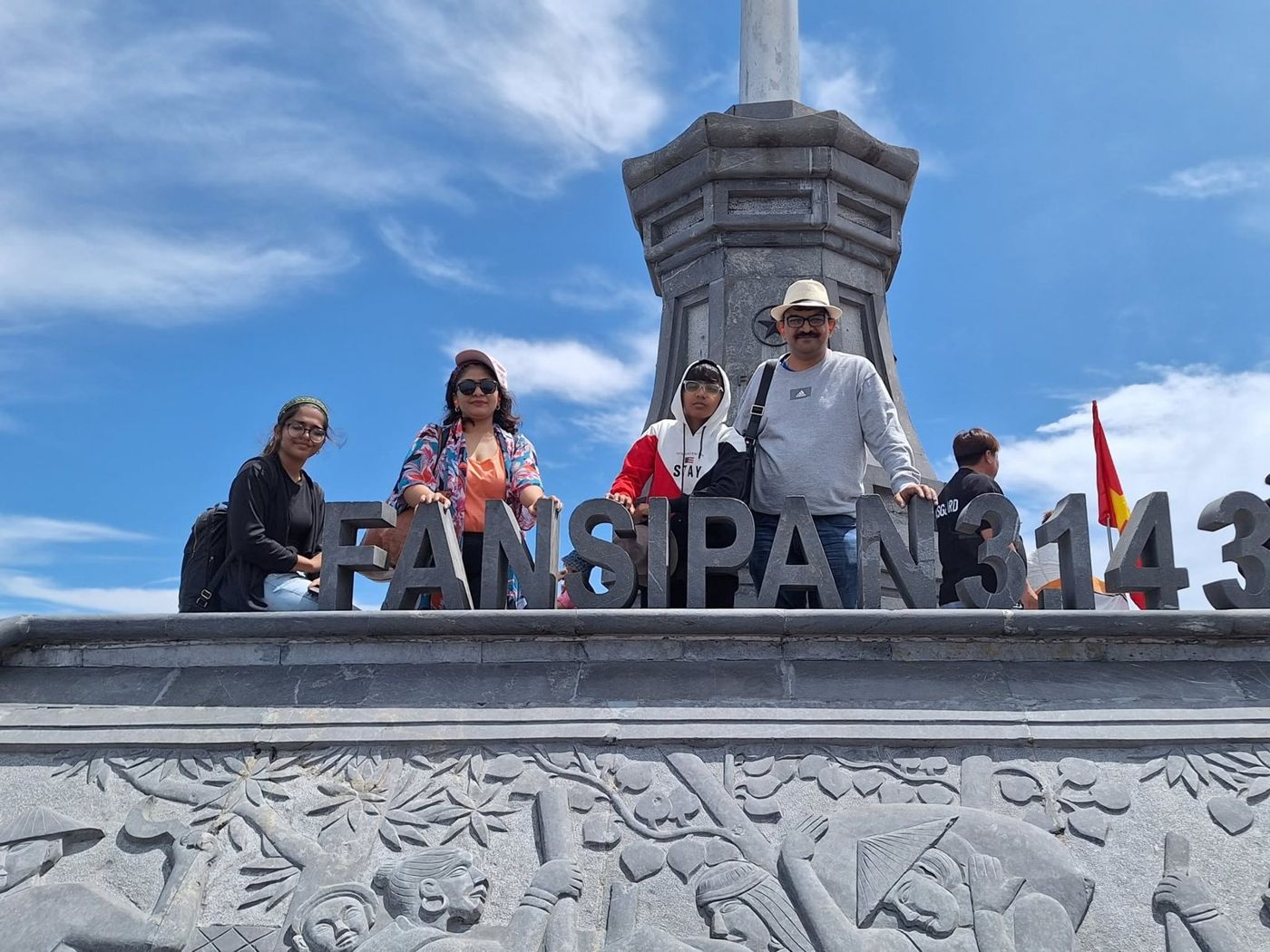 The family at the summit marker on Fansipan