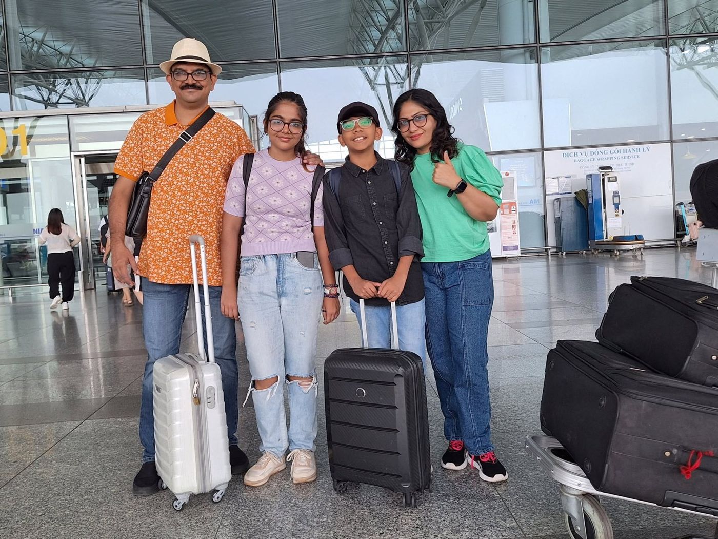 The family with suitcases at an airport