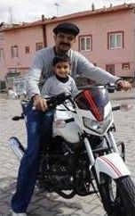 Bipin and Cyril on a motorbike in Turkey